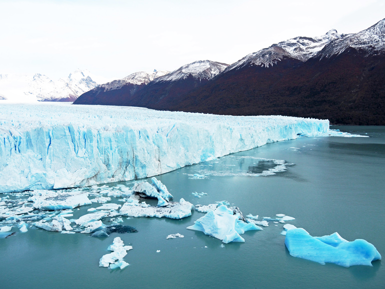 The huge Perito Moreno Glacier at the foot of the mountains of Patagonia.