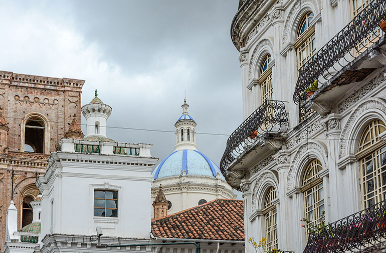 The blue-tiled domes of the New Cathedral in Park Calderon define the cityscape of Cuenca.