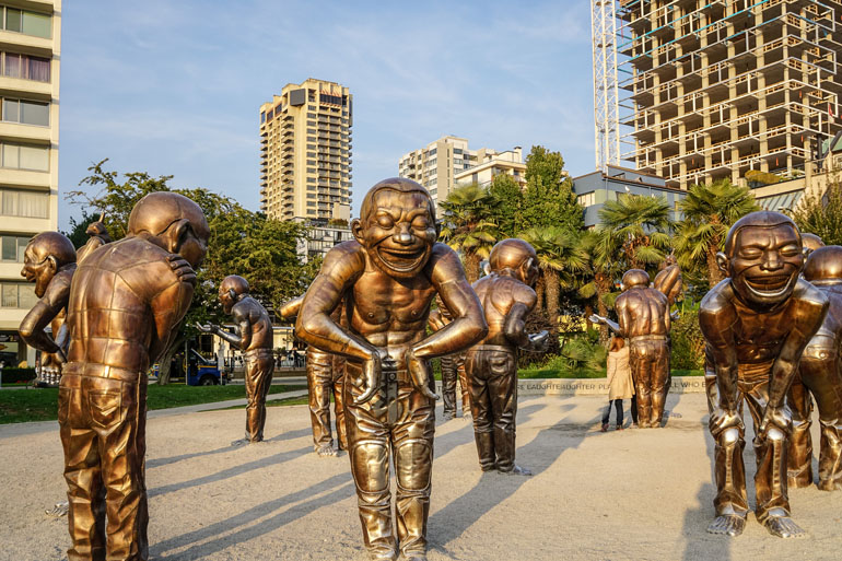 Vancouver: Golden Laughing Sculptures on English Bay, corner of Davie Street.