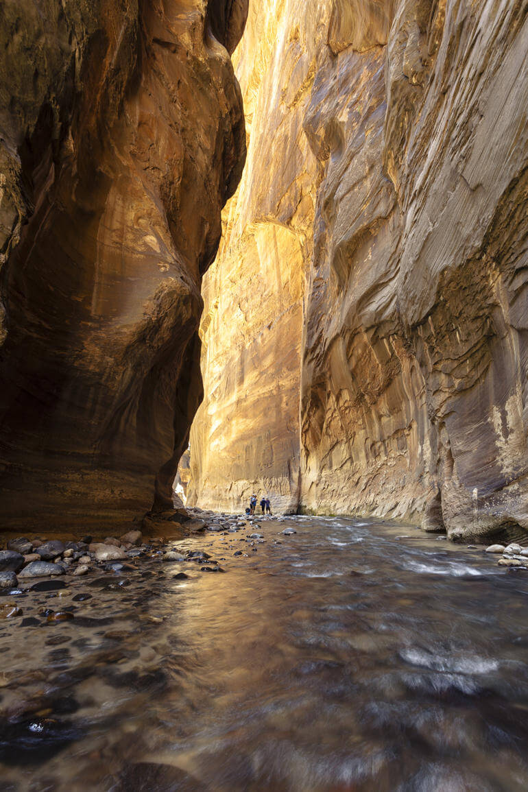 A river between two rock walls.