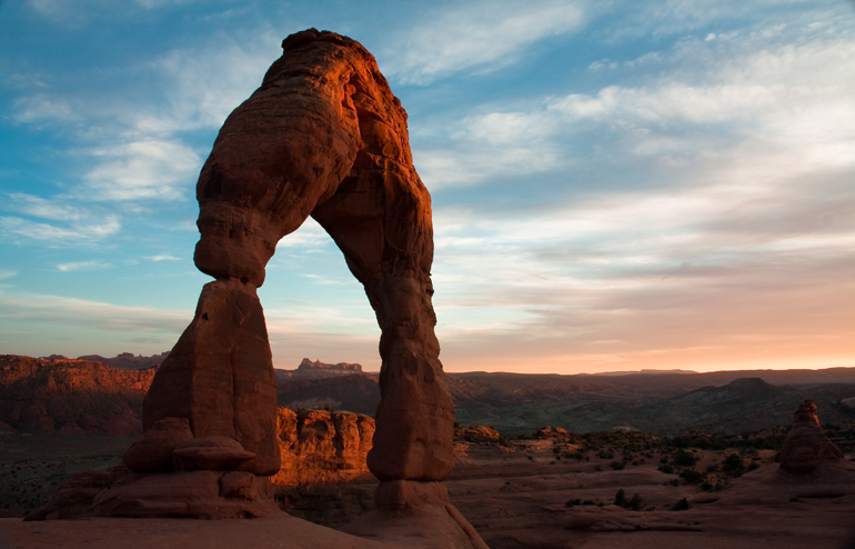 A rock arch in the light of the setting sun.