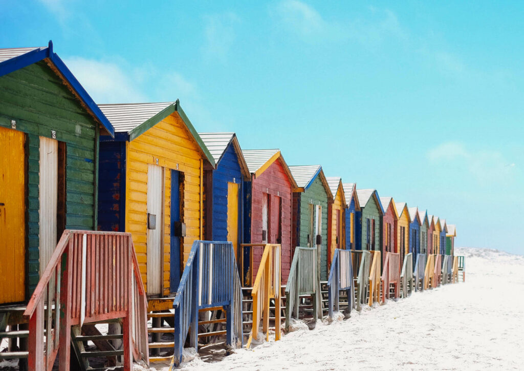 One of the most famous sights of the Muizenberg just outside of Cape Town are the colorful Edwardian Beach Houses.