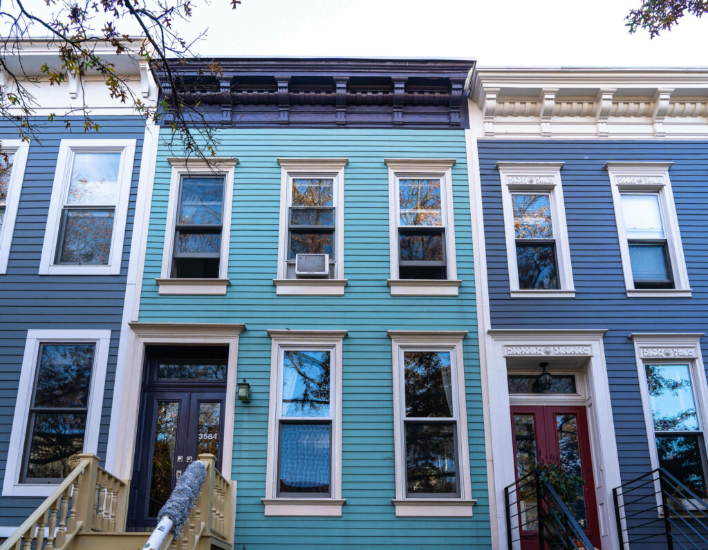 Blue wood-paneled houses grace the cityscape of the Park Slope neighborhood of Brooklyn in New York City.